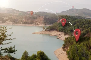 Mountain lake with travel route location pins on a map