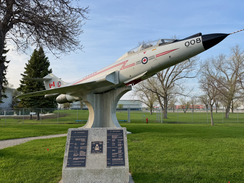 Air Force Heritage Air Park, Winnipeg: Planes, History and Coffee 21 CF-101B Voodoo jet aircraft on display pedestal with Canadian Armed Forces markings and identification plaque, mounted in a public park setting