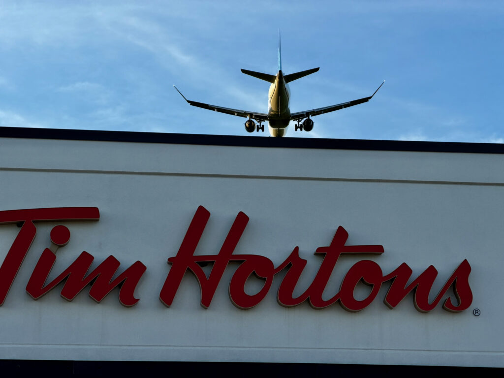 Air Force Heritage Air Park, Winnipeg: Planes, History and Coffee 3 Airplane flying over Tim Hortons sign