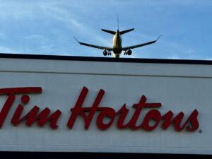 Air Force Heritage Air Park, Winnipeg: Planes, History and Coffee 7 Airplane flying over Tim Hortons sign