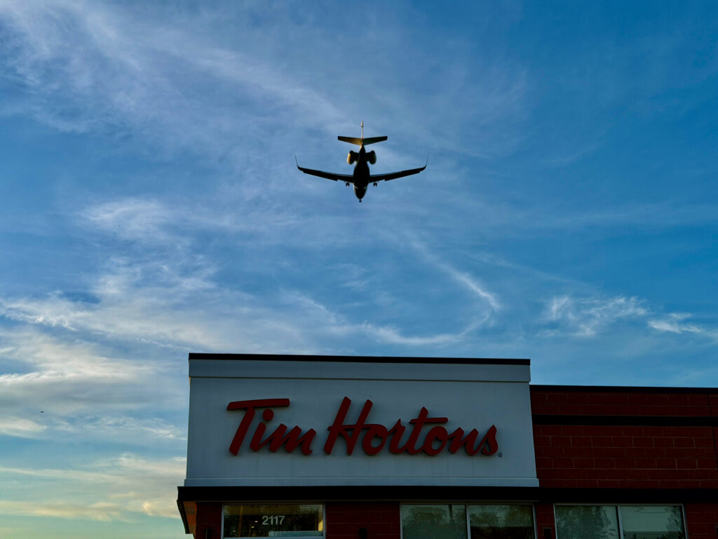 Air Force Heritage Air Park, Winnipeg: Planes, History and Coffee 4 Aircraft flying over a Tim Hortons location