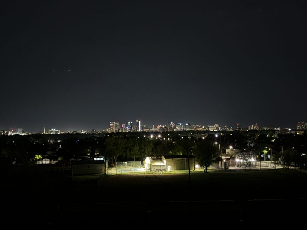 Westview Off-Leash Dog Park: Winnipeg's "Garbage Hill" and the First Park We Ever Walked in Canada 1 City skyline at night with lights from buildings and streetlights visible