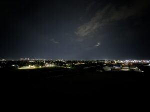 Westview Off-Leash Dog Park: Winnipeg's "Garbage Hill" and the First Park We Ever Walked in Canada 14 Night view of a city skyline with lights and clouds in the sky